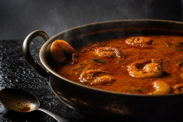 Prawn curry with coconut milk, cooked and plated