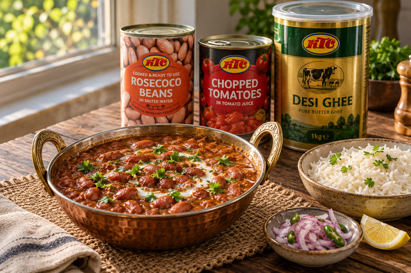Rajma masala in a copper karahi with rice, sliced onion and lemon, beside tins of KTC rosecoco beans, chopped tomatoes and desi ghee