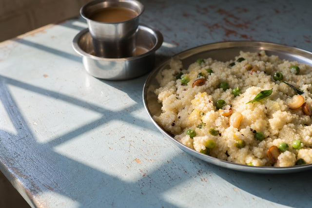 Rava upma with peas and cashews, cooked and plated